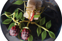 Paul J. Stankard, Raspberries wrapped around a  Honeycomb, 1993, Value $2,200