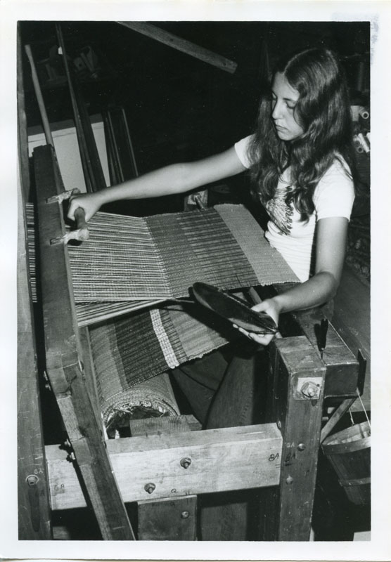 1974 Holly Pensa demonstrating weaving in the Crafts and Trade Building.