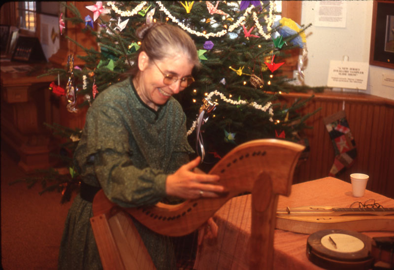 1997 Kathy DeAngelo tuning David Field's Celtic Harp for a performance in the DJFC