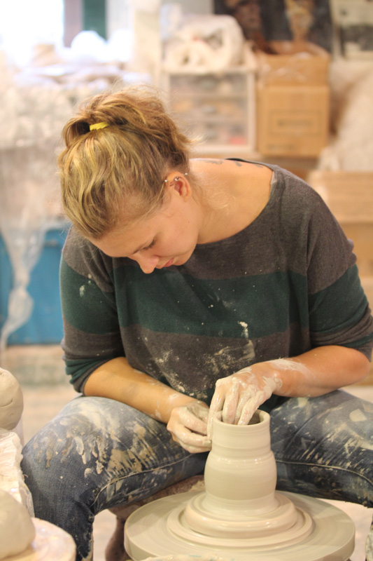 2014 Lauren Wymbs demonstrating in the Pottery during the Festival of Fine Craft