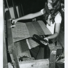 1974 Holly Pensa demonstrating weaving in the Crafts and Trade Building.