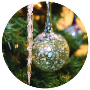 Circle crop glass icicle and ornaments hanging from tree