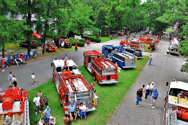 A line of red and blue fire tracks across WheatonArts Campus