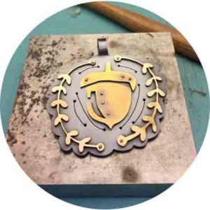 Metal Smith Jewelry with acorn in center