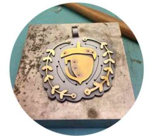 Metal Smith Jewelry with acorn in center
