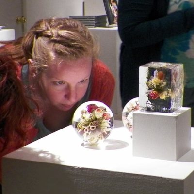 Paul Stankard's orb and botanical on display in The Gallery of Fine Craft