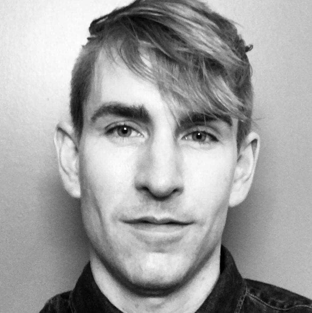 Black and white headshot of Aaron Pexa. 2019 Creative Glass Fellow