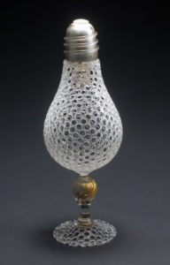 Glass Lightbulb by David King with small holes over the whole form of the bulb.