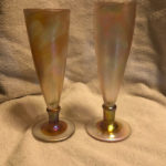 Two tall golden glass goblets by Joe Mattson