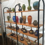 A booth showcasing the glass work of Joe Mattson