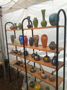 A booth showcasing the glass work of Joe Mattson