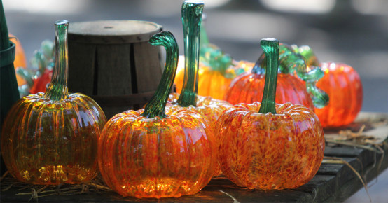orange glass pumpkins on display
