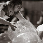 Jocelyn Prince holding large glass sculpture