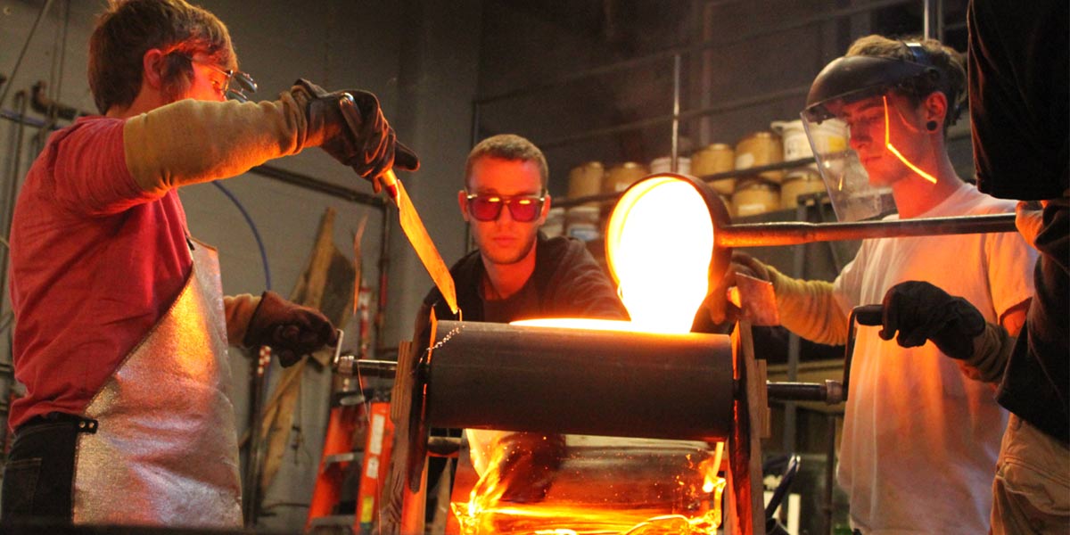 Artists working with hot glass.