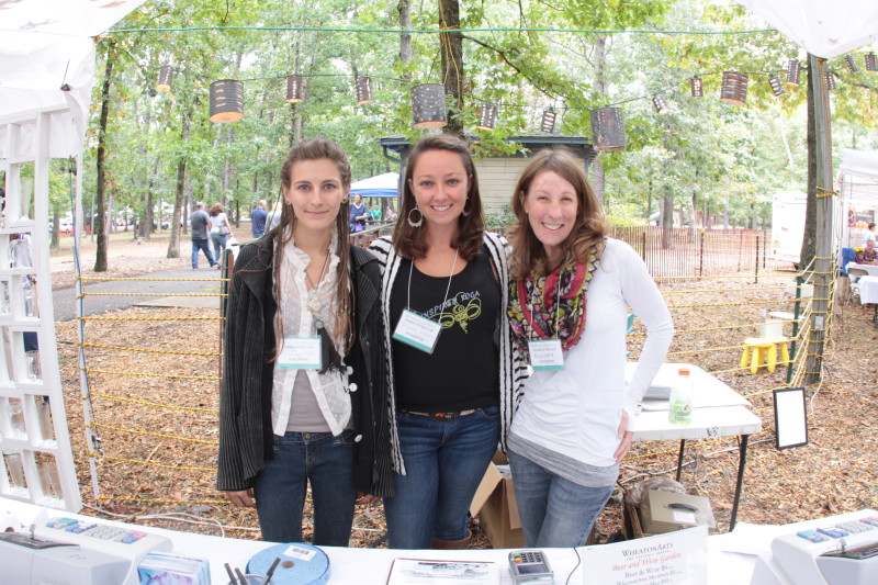 WheatonArts volunteers at booth