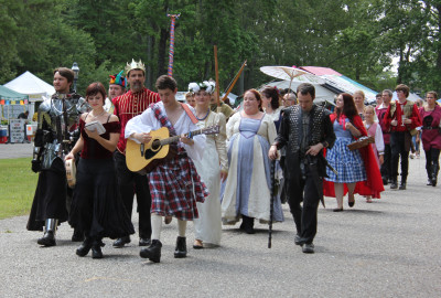 Professional stage and street magicians walking WheatonArts grounds