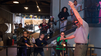 Students in the Glass Studio during a glassblowing demonstration