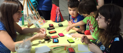 group of children making clay stamps