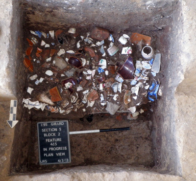 Archaeological excavation of a backyard privy filled with household debris. Photograph courtesy of AECOM and PennDOT.