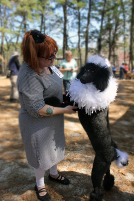 Woman and her black dog at WheatonBarks Dog Show