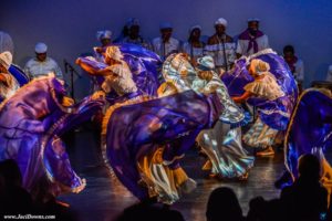 Group photo of people dancing in cultural dresses