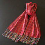 Long red vertical striped scarf by Pauletta Berger