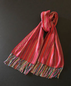 Long red vertical striped scarf by Pauletta Berger
