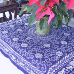 Indigo blue tablecloth with floral patterns by Shengzhu Bernardin