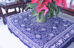 Indigo blue tablecloth with floral patterns by Shengzhu Bernardin