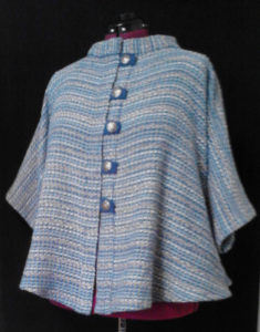 Blue buttoned shawl by Phillip Breden Jr