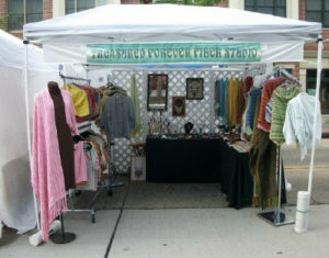 Booth showcasing the work of "Treasured Forever Fiber Studio", by Phillip Breden Jr
