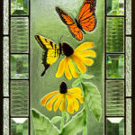 A glass panel of butterflies exploring a pair of black eyed susans by Karen Caldwell