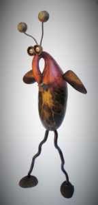 Carved gourd creature with a long snout, wings, and antennae by Robert Lehman