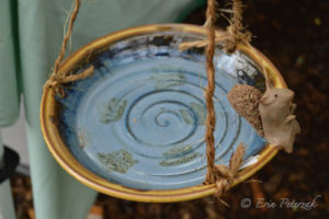 Ceramic bowl held up by rope by Tessa Peterzak