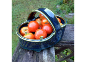 Ceramic Basket Holding Tomatoes by Chris Pettingill