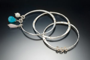 four bracelets by joan prato jewelry