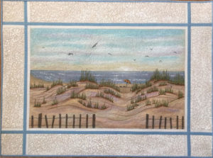An acrylic painting on cotton depicting dunes on the beach overlooking the ocean, seagulls fly over the scene with a white frame