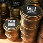 Several "Twist Candle Co." Candles Stacked on top of one another