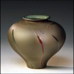 tan pottery vase by Michael Cho