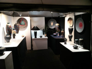 Booth displaying the work of artist Michael Cho