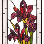 Stained glass panel of magenta flowers and their leaves by Dennis Christie