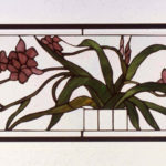 Stained glass panel of pink flowers and their sprawling leaves by Dennis Christie