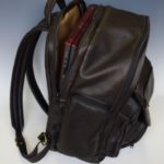 brown leather back pack by Clay Rosenbarker
