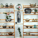 A shelf displaying work by ceramic artist Pamela Cummings