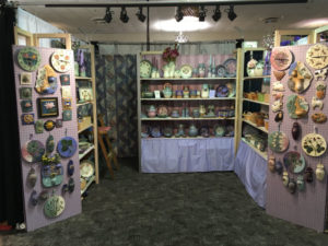 Booth displaying the work of ceramic artist Marsha Dowshen