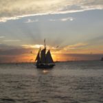 image of a sailboat during a sunrise