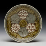 A yellow, white, and grey bowl decorated with complex patterns, by Lana Heckendorn