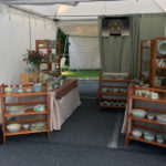 A booth displaying the ceramic work of artist Lana Heckendorn