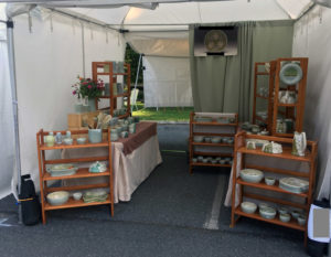 A booth displaying the ceramic work of artist Lana Heckendorn