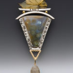 earth toned pendant with silver accents by Caryn Hetherston